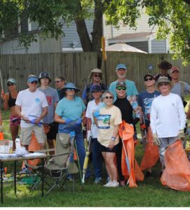 Group of people with litter grabbers and trash bags after doing a litter cleanup