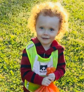 Boy picking up litter outside