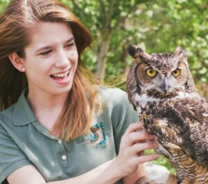Girl holding owl