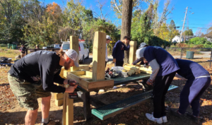 Men building wooden park benches