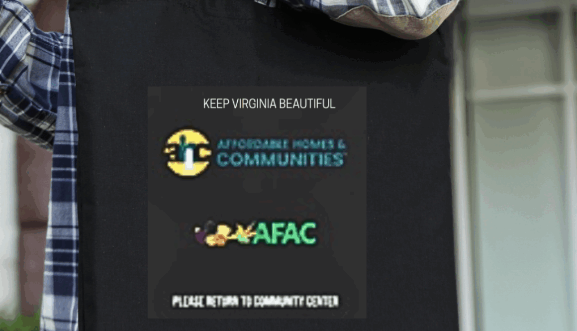 Photo with woman carrying a black re-usable grocery bag with logos