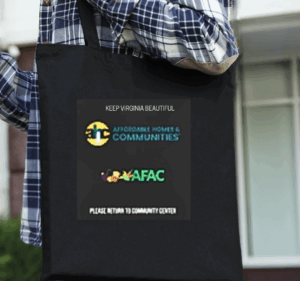 Photo with woman carrying a black re-usable grocery bag with logos