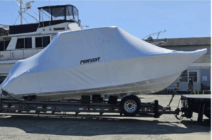 Photo of a large boat wrapped in shrink-wrap plastic to protect it from the elements while being transported or stored